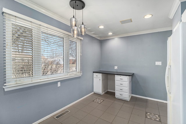 unfurnished office with ornamental molding, visible vents, baseboards, and tile patterned flooring