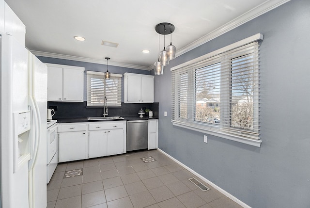 kitchen featuring stainless steel dishwasher, white fridge with ice dispenser, visible vents, a sink, and range with electric cooktop