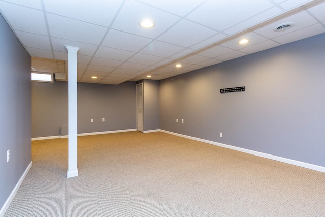 finished below grade area featuring light carpet, baseboards, and recessed lighting