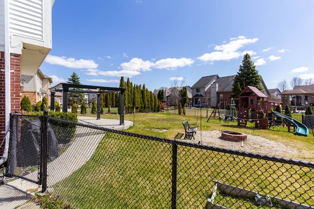 view of yard with a residential view, a fire pit, and a gazebo