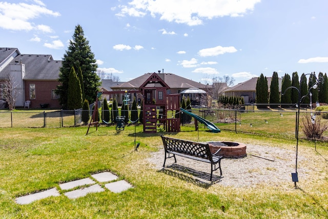 community jungle gym featuring an outdoor fire pit