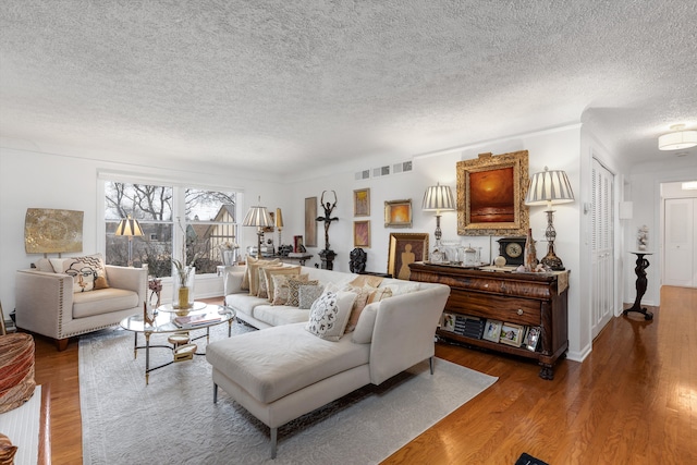 1750 Vernier Rd Unit 10, Grosse Pointe Woods, MI 48236 - living area with a textured ceiling and wood finished floors