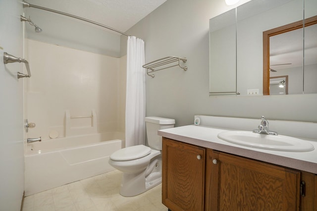 full bath with tile patterned floors, shower / bath combo with shower curtain, vanity, and toilet