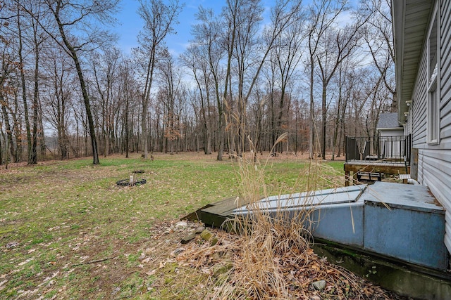 view of yard with a wooden deck