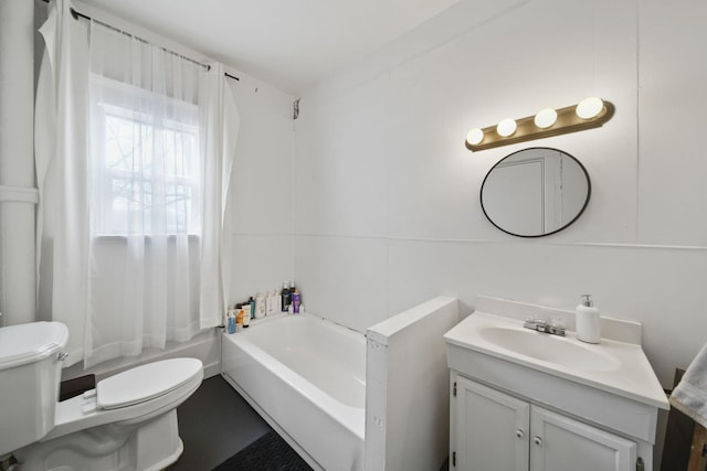 full bathroom featuring toilet, a bath, and vanity