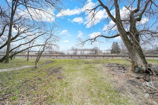 view of yard with a rural view