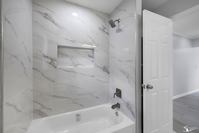 full bath with ornamental molding, shower / tub combination, and baseboards