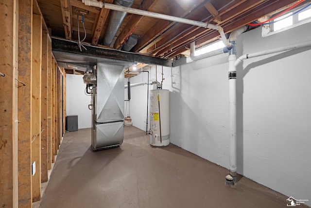 basement featuring heating unit and gas water heater