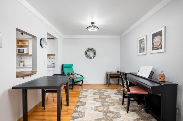 1209 Island Dr Unit 102, Ann Arbor, MI 48105 - home office featuring light wood-style floors, ornamental molding, and baseboards