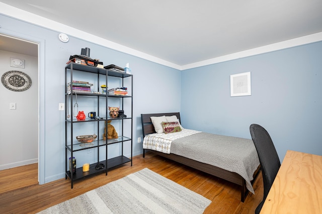 1209 Island Dr Unit 102, Ann Arbor, MI 48105 - bedroom featuring wood finished floors and baseboards