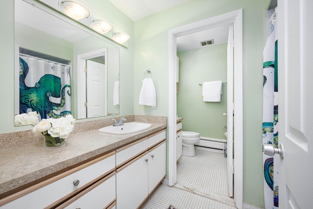 1209 Island Dr Unit 102, Ann Arbor, MI 48105 - full bath with toilet, tile patterned floors, a baseboard heating unit, and vanity