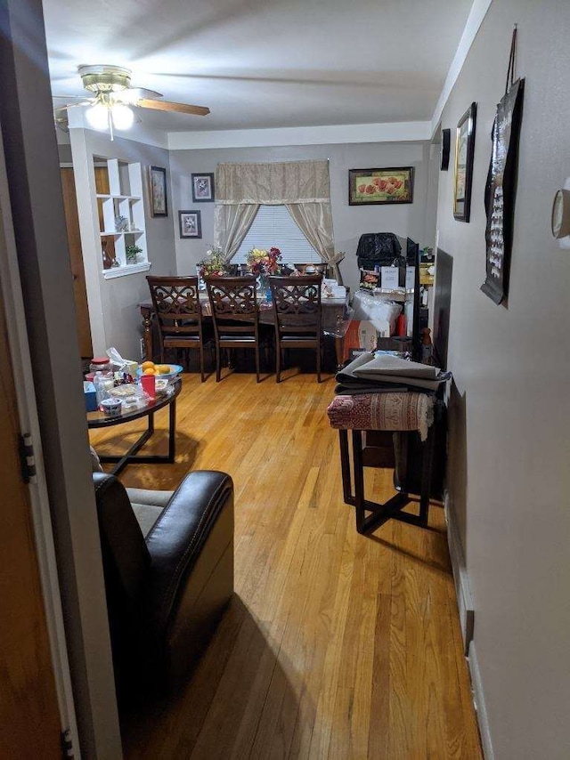 8021 Trafalgar St, Taylor, MI 48180 - living area featuring light wood-type flooring and ceiling fan