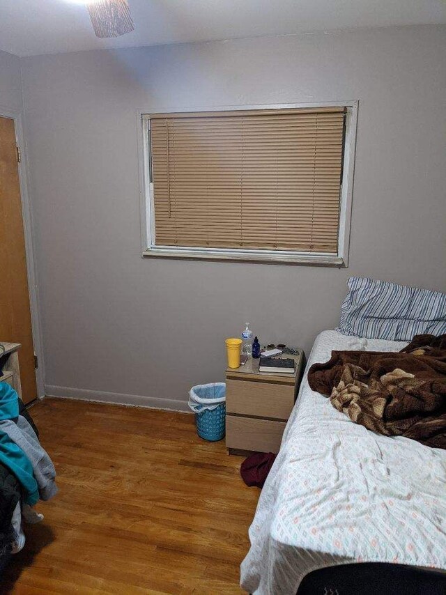 8021 Trafalgar St, Taylor, MI 48180 - bedroom featuring baseboards and wood finished floors