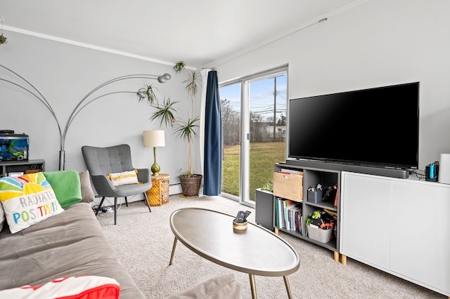 living area with crown molding, a baseboard heating unit, and carpet flooring