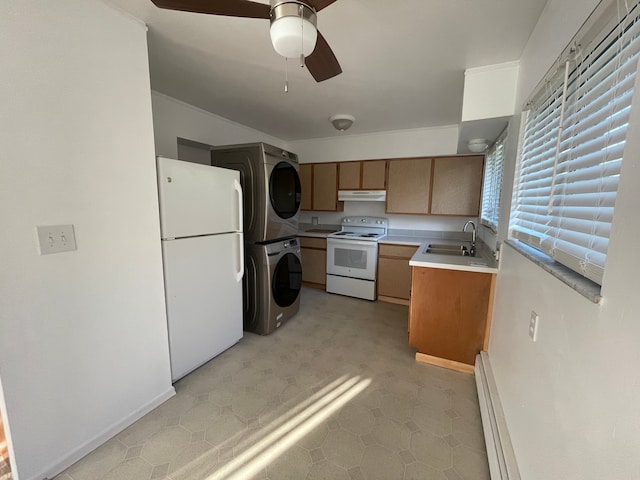 kitchen with white appliances, a ceiling fan, under cabinet range hood, a sink, and stacked washer / drying machine