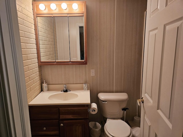 5409 N Mckinley Rd, Flushing, MI 48433 - half bath with vanity and brick wall