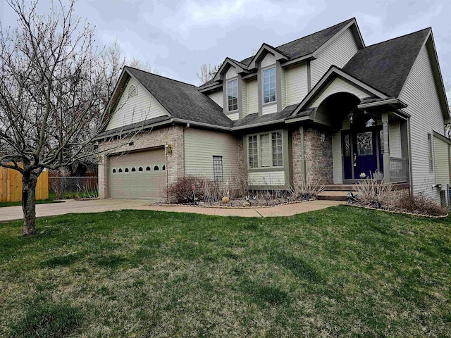 5409 N Mckinley Rd, Flushing, MI 48433 - traditional-style home with brick siding, driveway, a garage, and roof with shingles