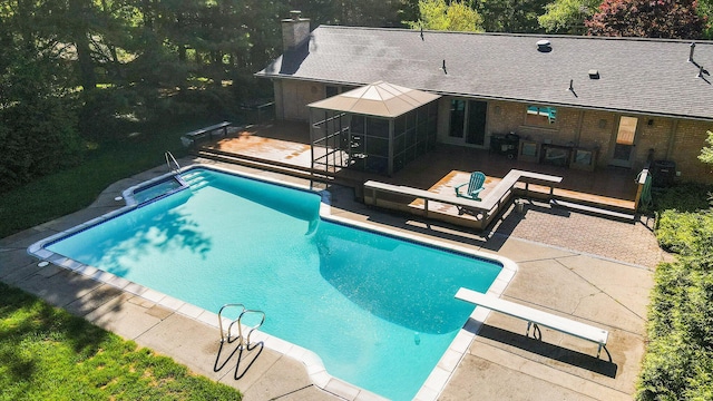 2693 Laurentide Dr, Ann Arbor, MI 48103 - swimming pool featuring a patio, a wooden deck, and a diving board