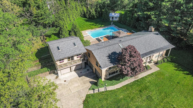 2693 Laurentide Dr, Ann Arbor, MI 48103 - view of subject property with a pool and a heavily wooded area