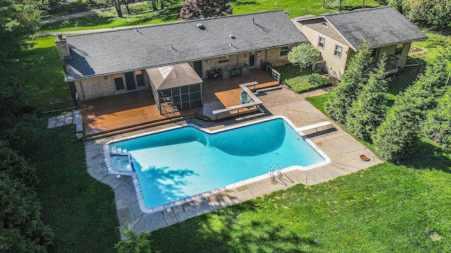 2693 Laurentide Dr, Ann Arbor, MI 48103 - outdoor pool featuring a wooden deck, a lawn, a patio area, and a diving board