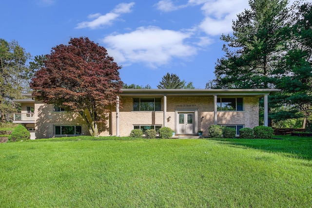 2693 Laurentide Dr, Ann Arbor, MI 48103 - bi-level home featuring a front lawn and brick siding