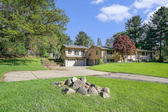 2693 Laurentide Dr, Ann Arbor, MI 48103 - view of front facade featuring an attached garage, driveway, a balcony, and a front yard