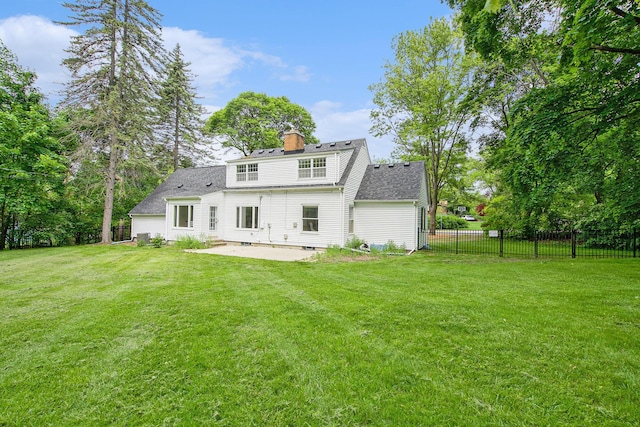 2690 Overridge Dr, Ann Arbor, MI 48104 - back of property with a patio area, a chimney, and a shingled roof