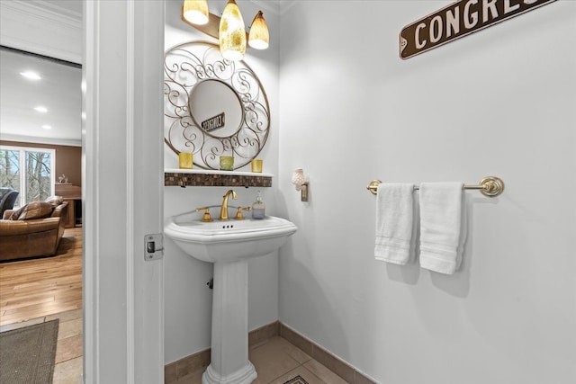 bathroom featuring baseboards, tile patterned flooring, and recessed lighting