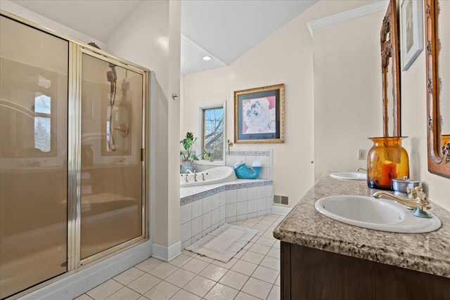 bathroom featuring a bath, a sink, visible vents, tile patterned flooring, and a shower stall