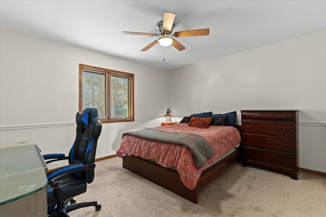 carpeted bedroom with baseboards and ceiling fan