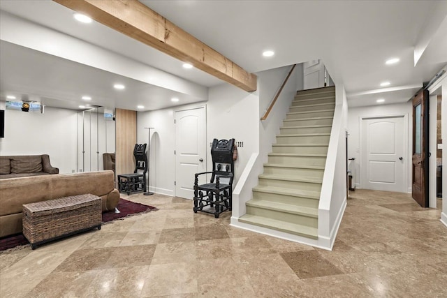 interior space featuring baseboards, recessed lighting, and stairway