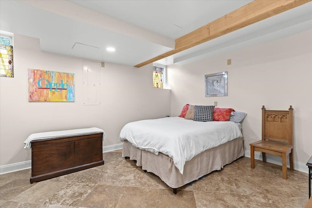 bedroom with beam ceiling, baseboards, and multiple windows