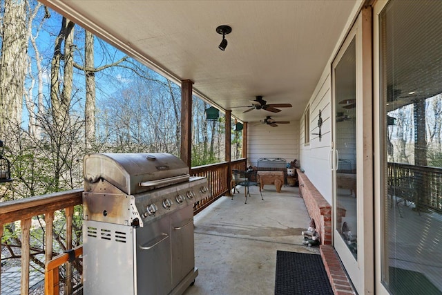 view of patio with ceiling fan and area for grilling