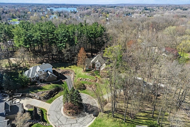 aerial view featuring a wooded view