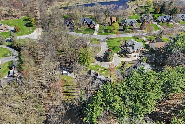 drone / aerial view with a residential view and a water view