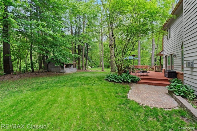 5721 Coralwood Ct, Commerce Twp, MI 48382 - view of green lawn featuring a deck
