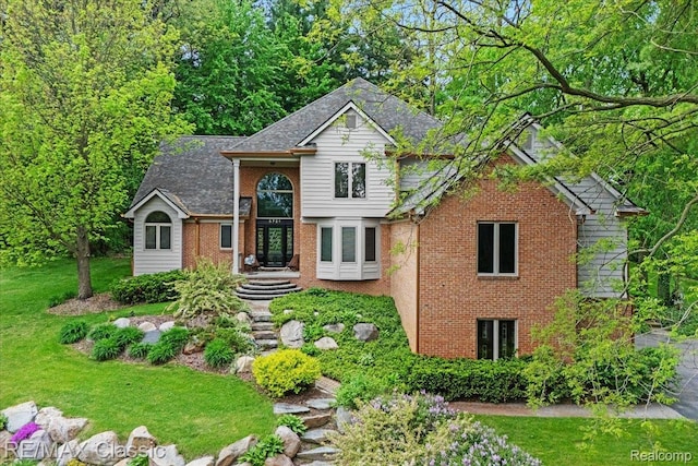 5721 Coralwood Ct, Commerce Twp, MI 48382 - traditional home featuring brick siding, a front yard, and a shingled roof