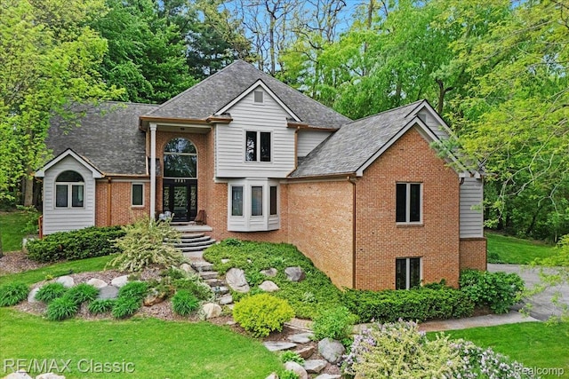 5721 Coralwood Ct, Commerce Twp, MI 48382 - traditional-style house with brick siding and roof with shingles