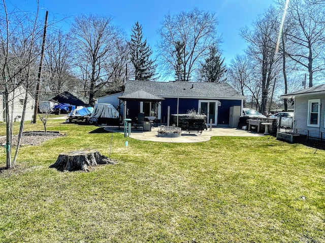 rear view of property with a patio, a yard, roof with shingles, and a gazebo