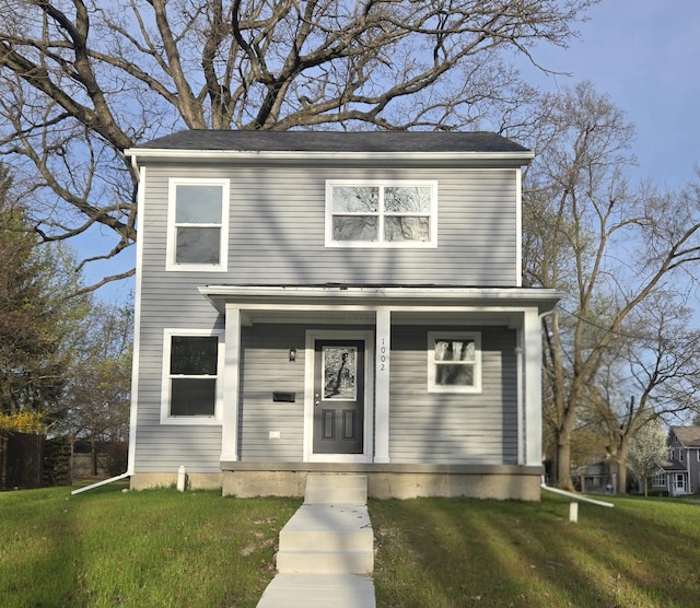 view of front facade with a porch and a front yard