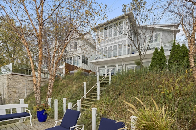 back of property featuring stairway