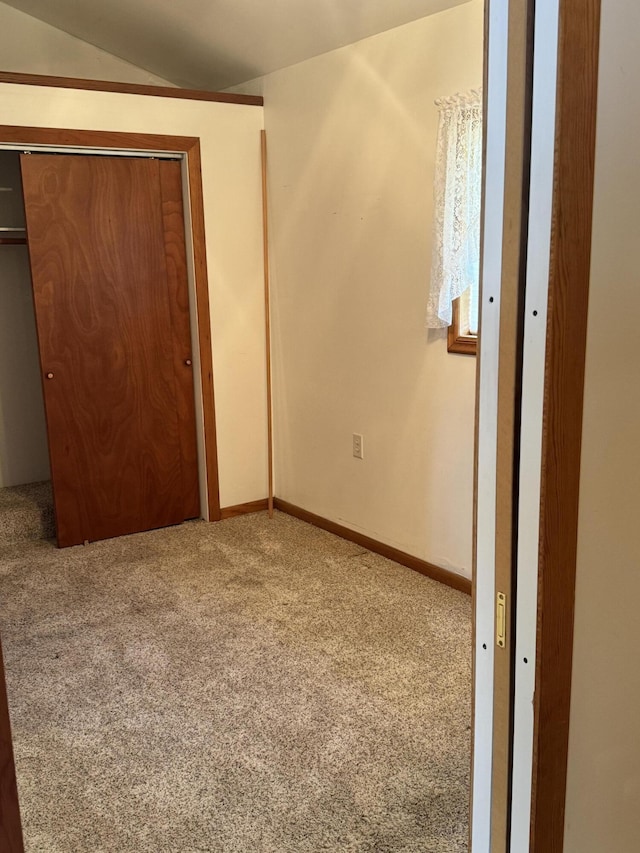 170 Tuttle Park Dr, Sherwood, MI 49089 - unfurnished bedroom with carpet flooring, lofted ceiling, and a closet