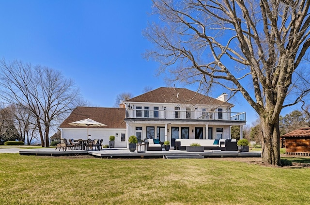 6376 Sterling Dr, Newport, MI 48166 - rear view of house with a chimney, a lawn, an outdoor hangout area, and a balcony