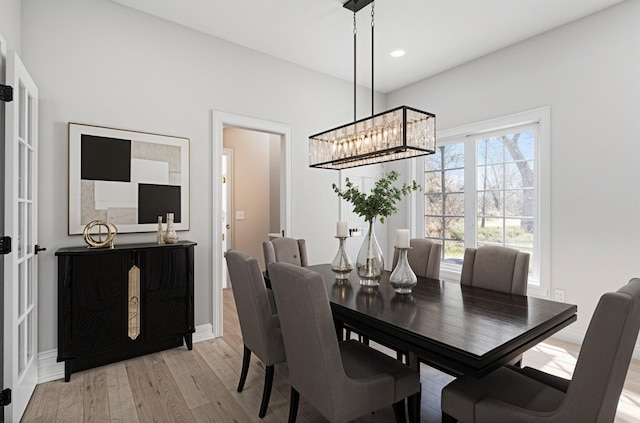 6376 Sterling Dr, Newport, MI 48166 - dining space featuring baseboards, recessed lighting, an inviting chandelier, and light wood-style floors