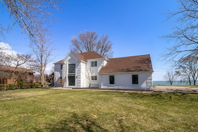 6376 Sterling Dr, Newport, MI 48166 - back of house featuring roof with shingles and a yard