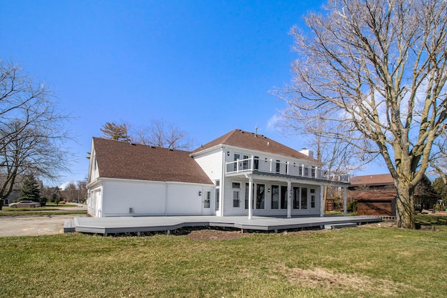 6376 Sterling Dr, Newport, MI 48166 - rear view of property featuring a balcony, a wooden deck, and a lawn
