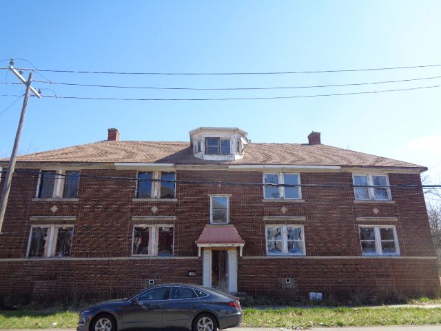 7538 Firwood St, Detroit, MI 48204 - townhome / multi-family property with a chimney and brick siding