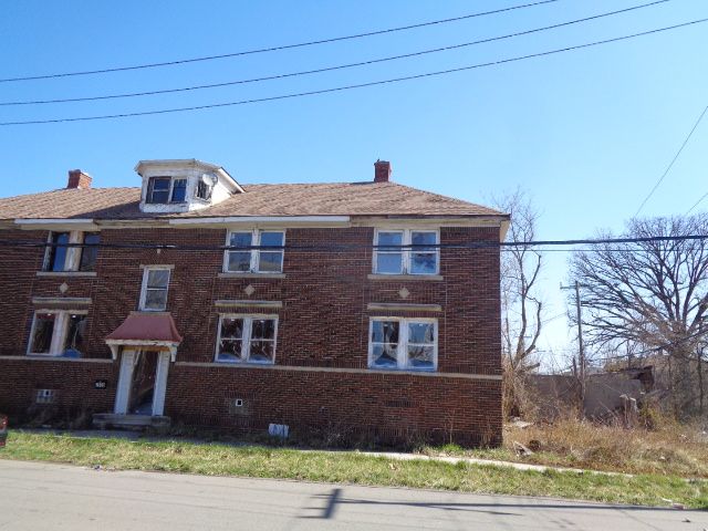 7538 Firwood St, Detroit, MI 48204 - townhome / multi-family property featuring brick siding and a chimney