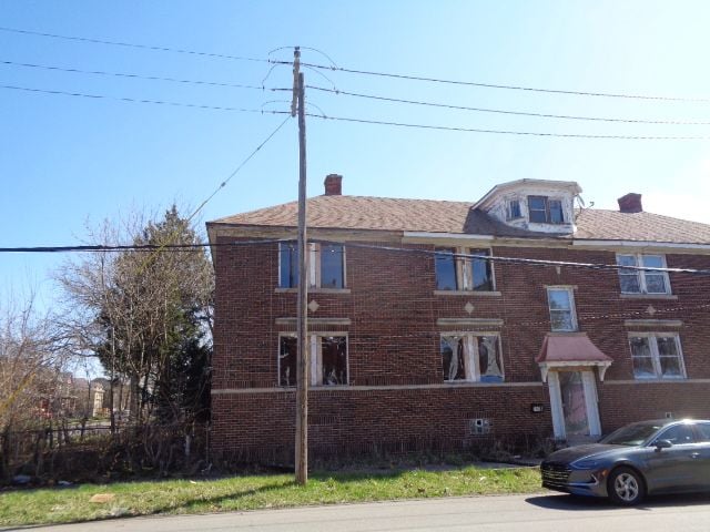 7538 Firwood St, Detroit, MI 48204 - view of property featuring brick siding and a chimney