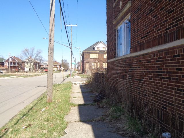 7538 Firwood St, Detroit, MI 48204 - view of street with curbs, a residential view, street lighting, and sidewalks